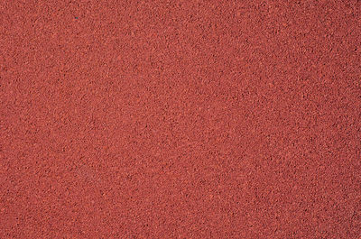 Red fine gravel. stone background. extraction of natural materials.