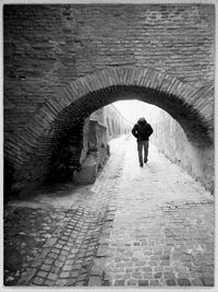 People walking in tunnel