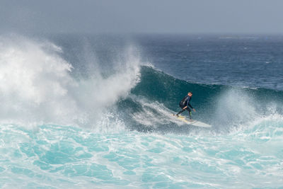 Man surfing in sea