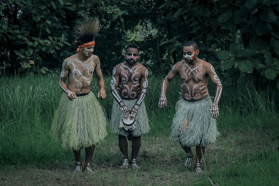 Group of people standing on field