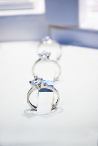 Close-up of wedding rings on table