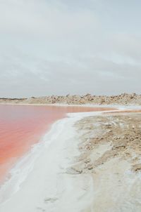 Scenic view of water against sky