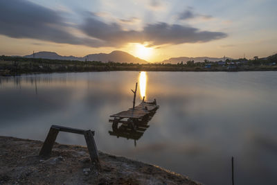 Scenic view of lake against sky during sunset