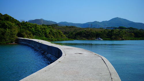 Scenic view of mountains against clear blue sky