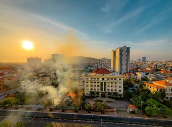 High angle view of buildings against sky during sunset