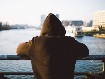 Rear view of man looking at sea