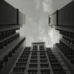 Directly below view of building against sky