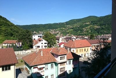 High angle view of houses against clear sky