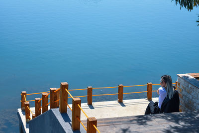 Rear view of woman looking at sea