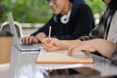 Midsection of business colleagues working at office