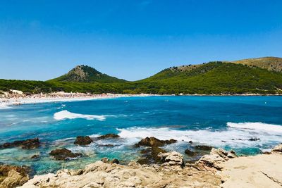 Scenic view of sea against clear blue sky