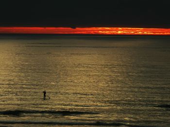 Scenic view of sea against sky at sunset