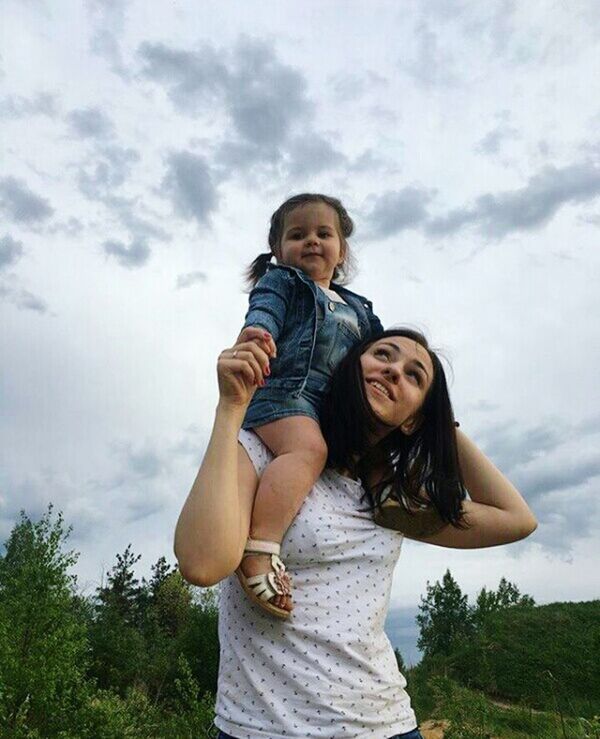 women, two people, cloud - sky, togetherness, females, sky, emotion, smiling, casual clothing, happiness, standing, positive emotion, looking at camera, three quarter length, child, tree, adult, bonding, people, nature, hair, daughter, hairstyle, outdoors