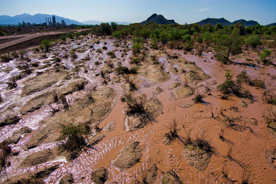 High angle view of rocks on land against sky