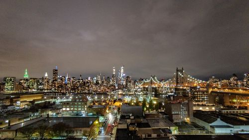 High angle view of illuminated buildings in city at night