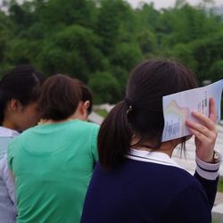 Rear view of couple holding hands