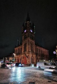 Illuminated buildings in city at night