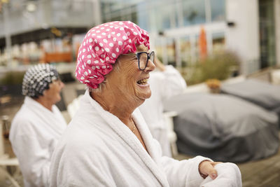 Happy senior woman in spa