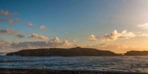 Scenic view of sea at sunset