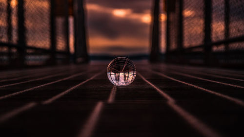 Close-up of crystal ball on footbridge