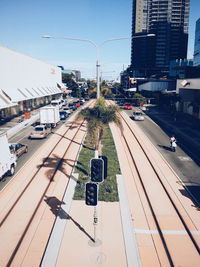 High angle view of vehicles in city during sunny day