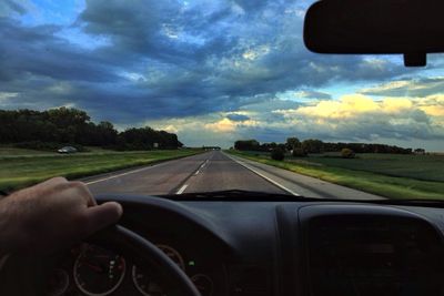 Cropped image of car on road