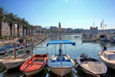 Boats moored at harbor