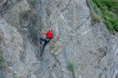 High angle view of man walking on rock