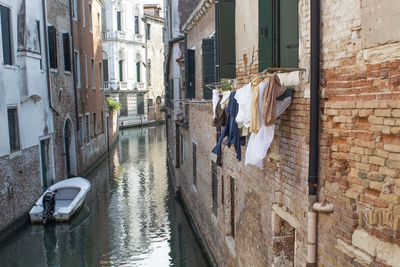 Canal amidst buildings in city