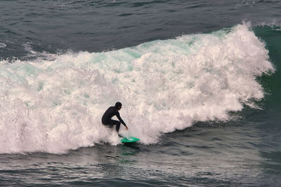 Man surfing in sea