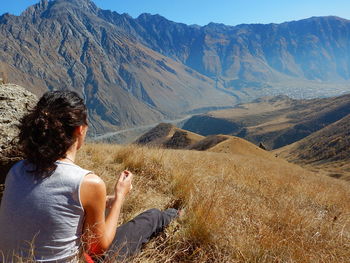 Rear view of woman looking at mountains