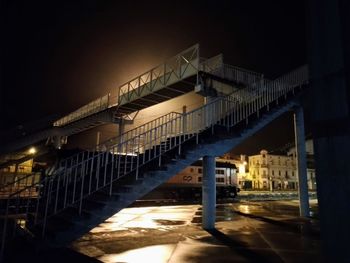 Low angle view of illuminated building against sky at night