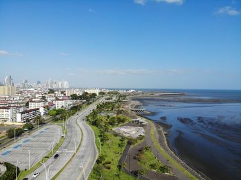 High angle view of sea and buildings against sky