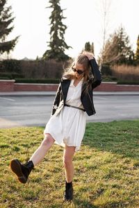 Rear view of woman standing on field