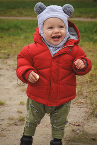 Portrait of cute boy wearing hat on field