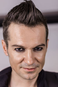 Close-up portrait of smiling young man