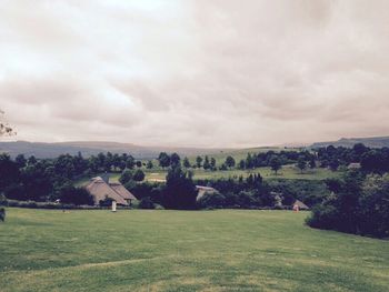 Scenic view of landscape against cloudy sky