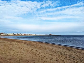 Beach scene with blue skies