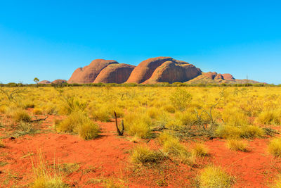 Scenic view of land against clear blue sky