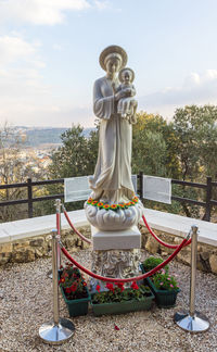 Statue of buddha against sky