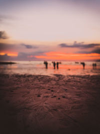 Scenic view of beach against sky during sunset