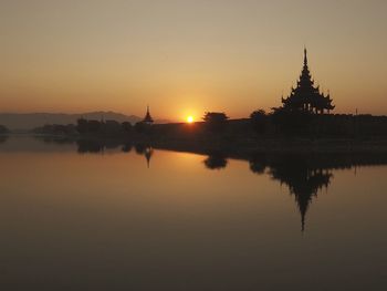 Scenic view of lake against sky during sunset