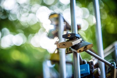 Close-up of padlocks hanging on metal