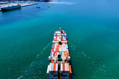 High angle view of  shipping containers sailing in sea