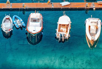 High angle view of sailboats moored in sea