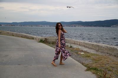 Woman standing on beach