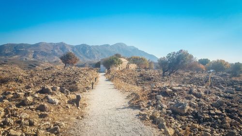 Panoramic view of landscape against clear blue sky