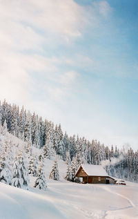 Scenic view of snow covered landscape against sky