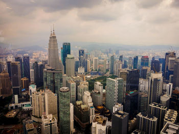 Aerial view of cityscape against sky