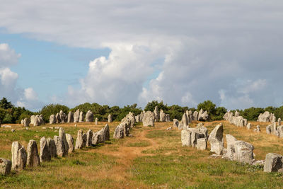 Panoramic view of old ruins on field against sky
